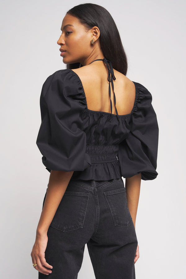 Bailey 44  Shani Peplum Top in Black back view with tie back