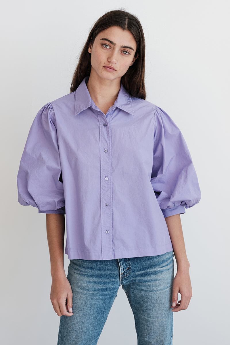 Stateside Structured Poplin Puff Sleeve Shirt in Iris-hands by her side