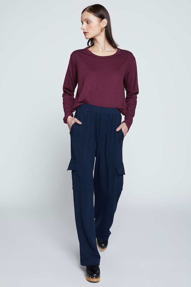 Stateside Softest Fleece Wide Leg Cargo Pant-model is looking off to the side with her hands in her pocket