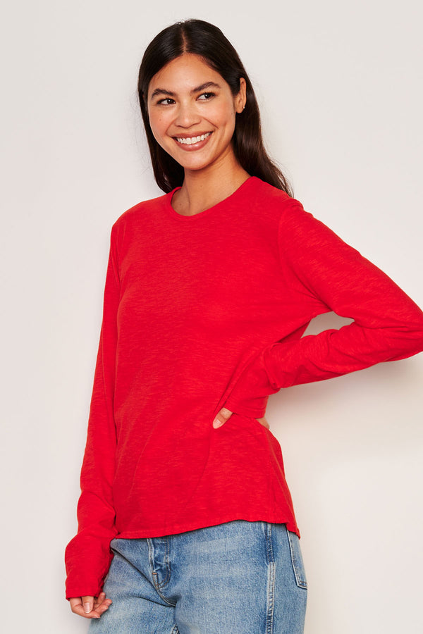 Sundry Long Sleeve Crew in Flare Red-side view model has her hand on her hip