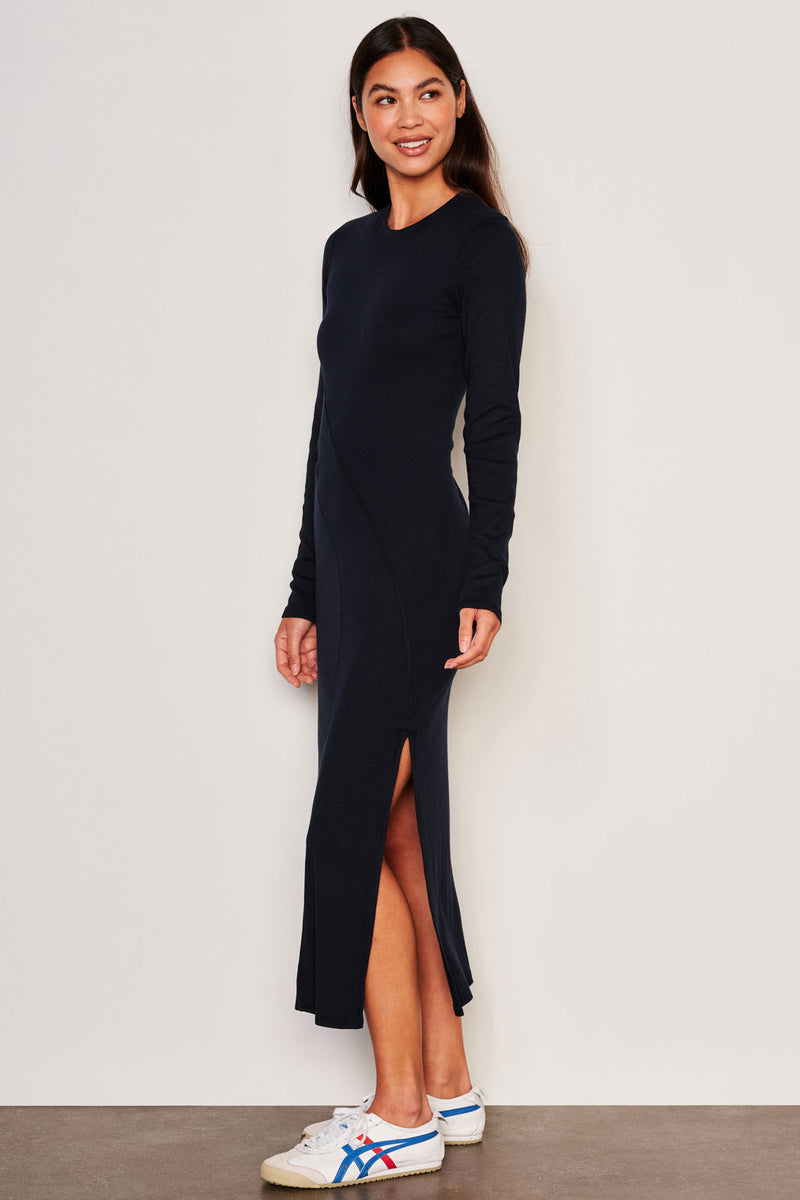 Sundry Midi Wave Dress in Deep Navy Info-side view slit is showing and model is looking away