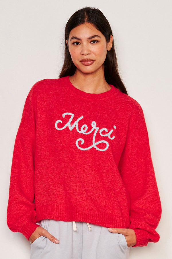 Sundry Merci Crew Neck Sweater in Flare Red-3/4 front model has her hands in her pocket 