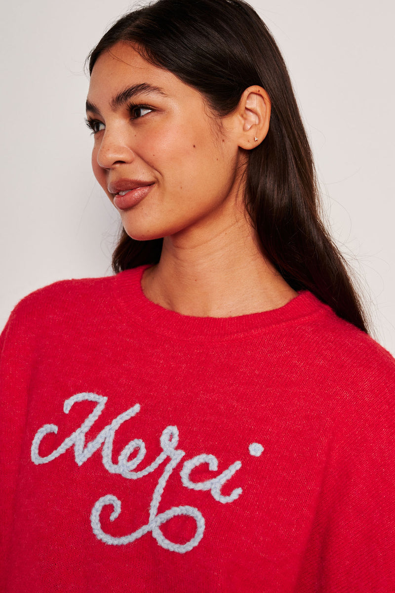 Sundry Merci Crew Neck Sweater in Flare Red-close up model is looking away 