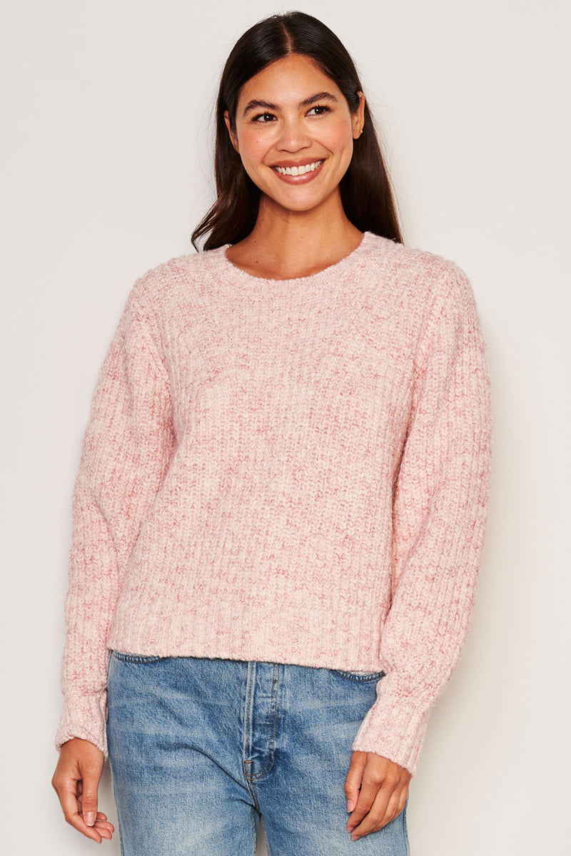 Sundry Rib Transfer Crew Neck Sweater in Guava-3/4 front model is smiling and looking away from the camera