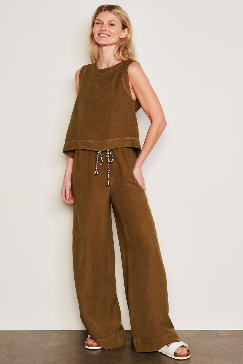 Sundry Linen Wide Leg Pant in Olive-full front view model is smiling and has her hand resting on her side