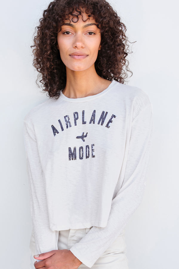 Sundry Mode Long Sleeve Crew in Cream-model is holding one of her arms