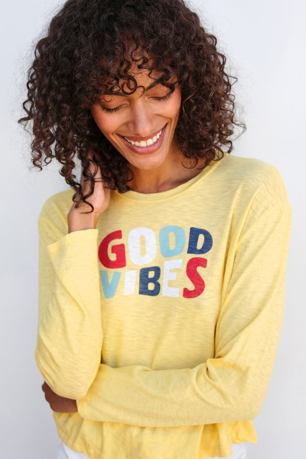 Sundry Good Vibes Long Sleeve Crew in Pigment Gold-close up model looking down 
