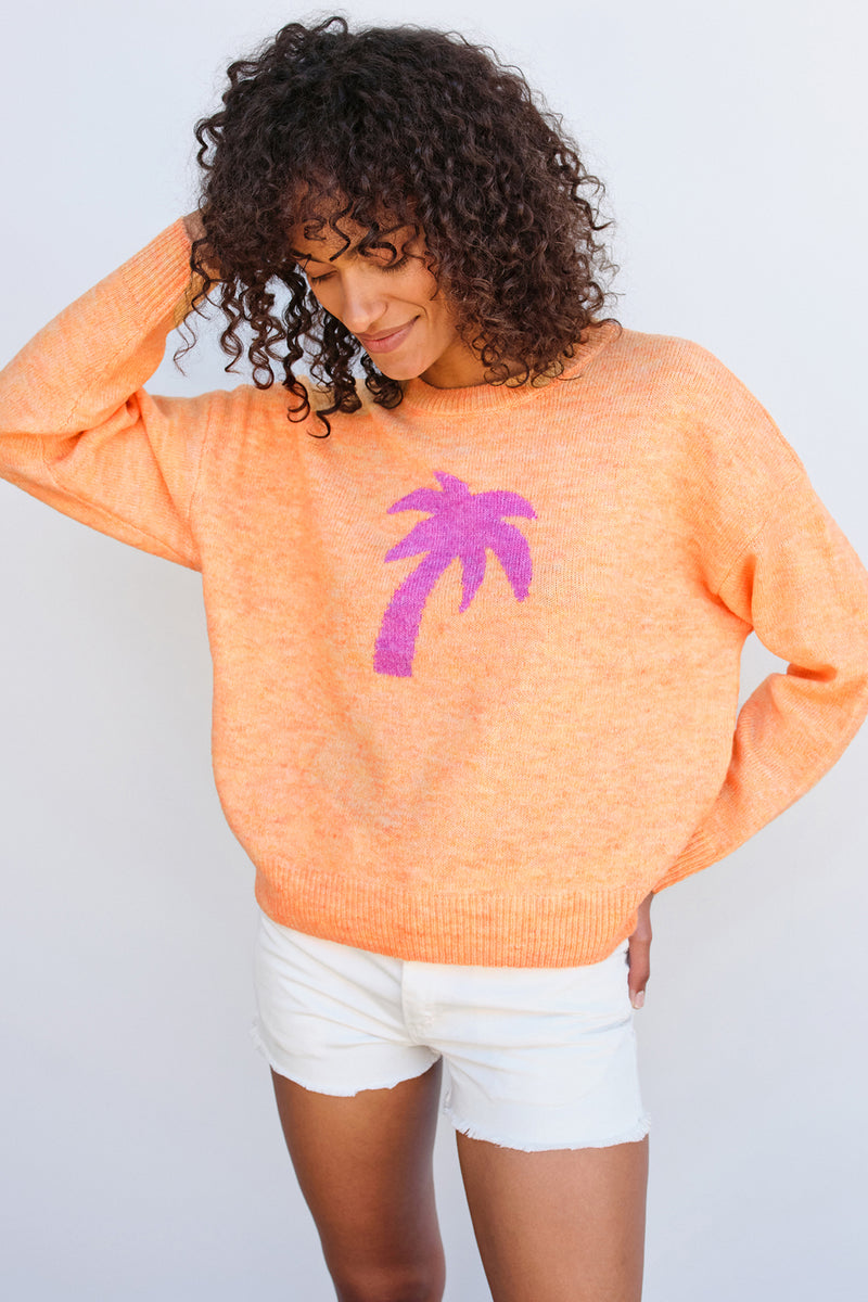 Sundry Palm Tree Oversized Sweater in Sorbet-model has her hand on her head