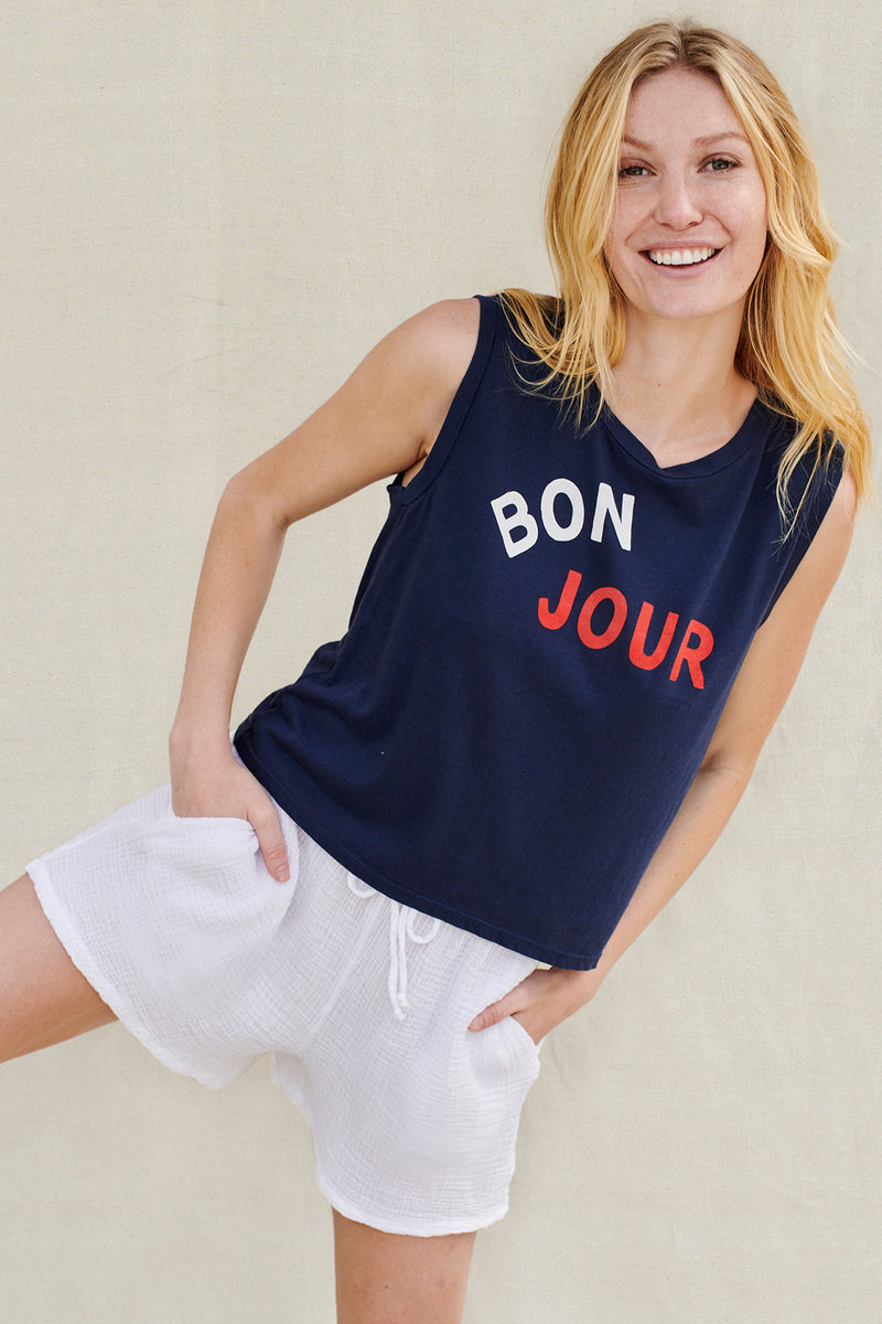 Bonjour Cropped Muscle Tank in Navy- model has her leg lifted