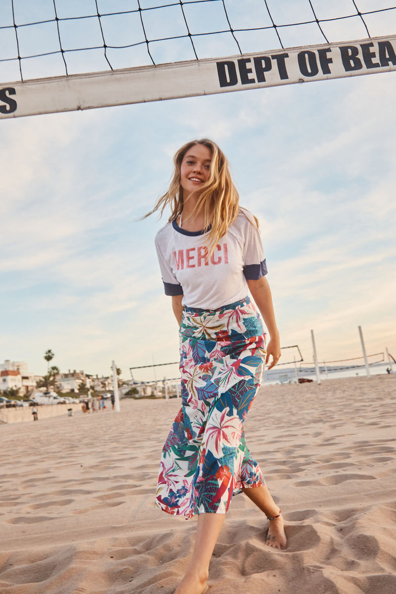 Sundry Merci Boyfriend Tee in Optic White-model playing in the sand under volleyball net