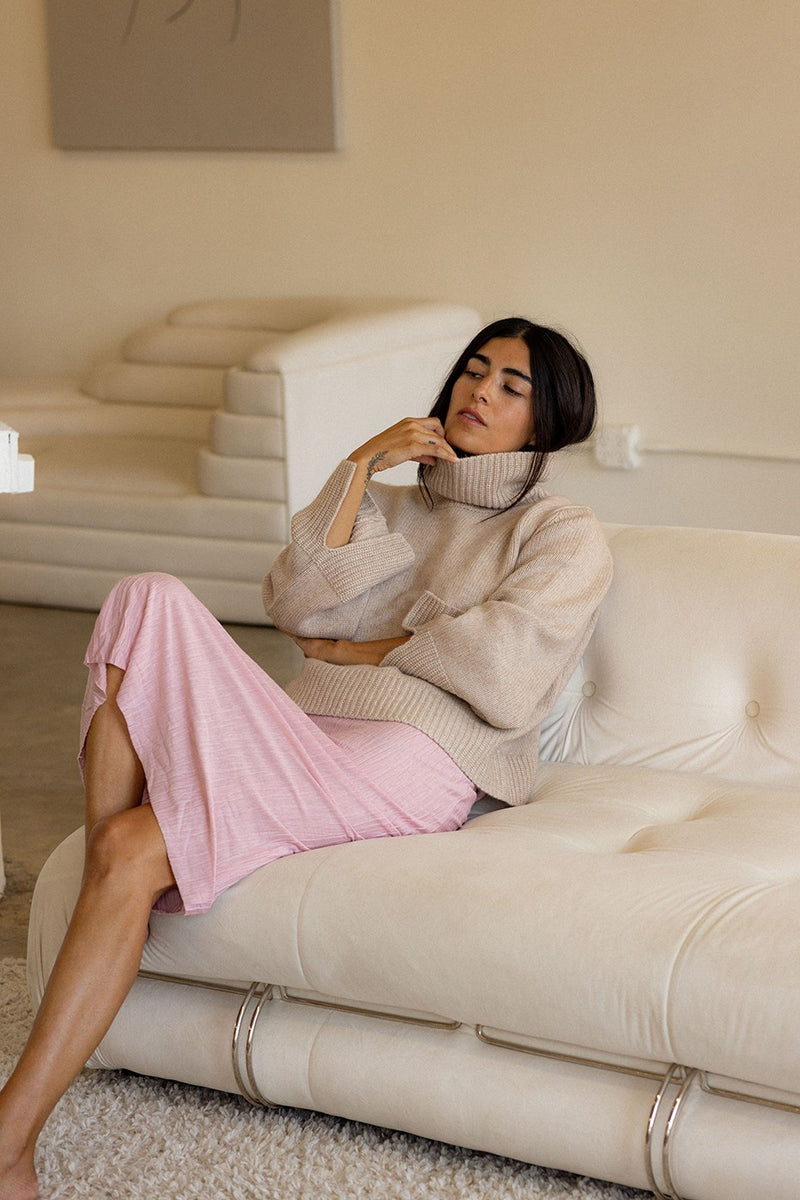 Cozy Cashmere Turtleneck Sweater in Camel - sitting arms crossed