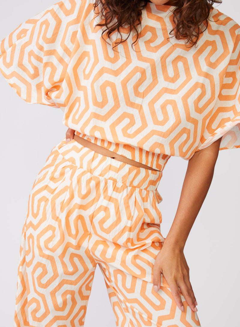 Geo Print Voile Wide Leg Pant in Cantaloupe - front close up waist